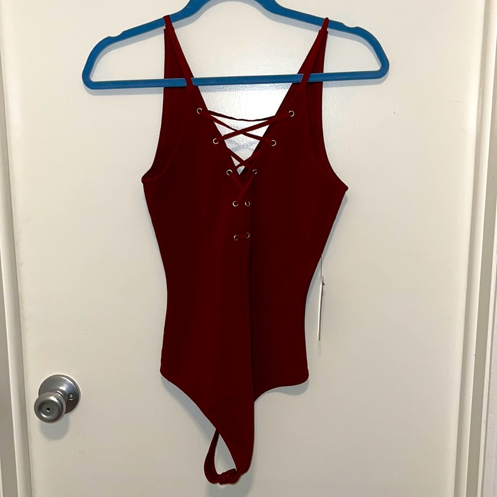 Super cute thong bodysuit! Never worn! Size extra small